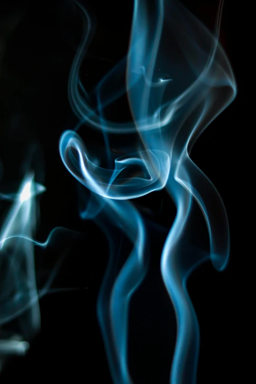 a close up of smoke on a black background, by Greg Rutkowski, pexels contest winner, glowing tiny blue lines, praying with tobacco, twirls, diffused