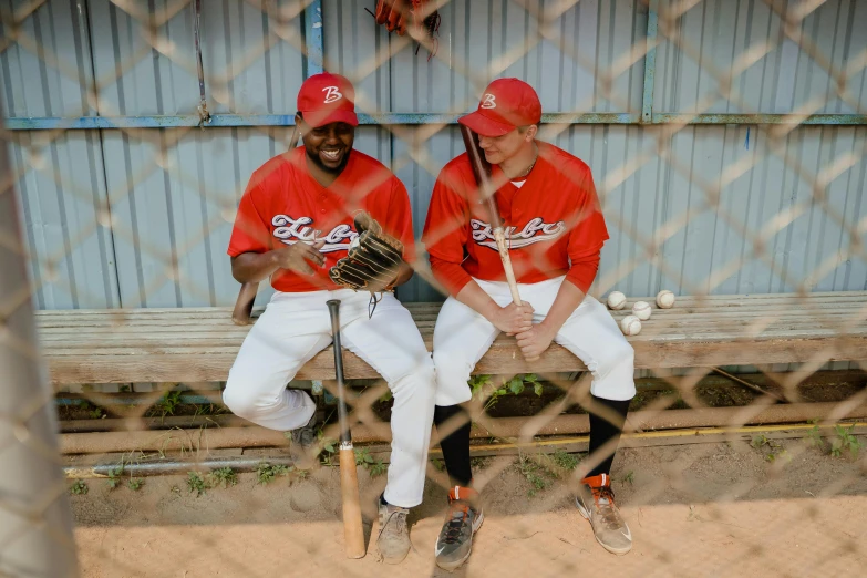 a couple of baseball players sitting on a bench, documentary photo, 15081959 21121991 01012000 4k, red horns, high quality upload