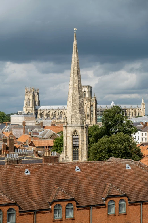 a view of a city from the top of a hill, by David Simpson, pexels contest winner, renaissance, hull, lead - covered spire, 1999 photograph, white buildings with red roofs