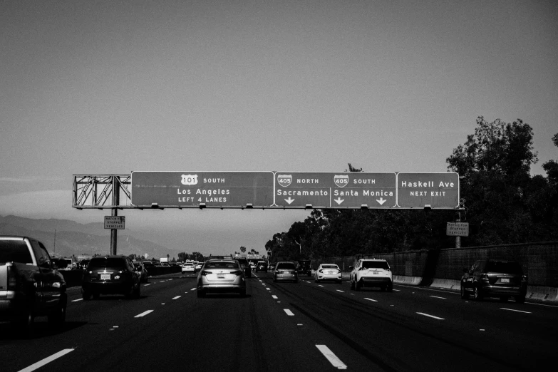 a black and white photo of a freeway, by Josh Bayer, unsplash, graffiti, gta v poster, 1024x1024, traffic signs, giants