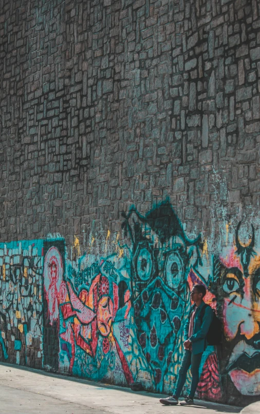 a man riding a skateboard up the side of a wall, pexels contest winner, graffiti, mosaic, black and teal paper, panoramic shot, group photo