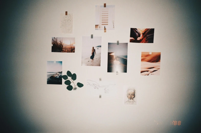 a wall that has a bunch of pictures on it, a polaroid photo, inspired by Elsa Bleda, trending on pexels, postminimalism, cozy room, zen aesthetic, scratches on photo, low angle photograph