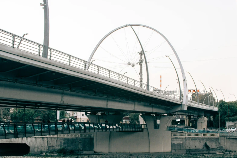 a bridge that is over a body of water, a portrait, unsplash, hurufiyya, monorail station, downtown mexico, 2000s photo, white sweeping arches