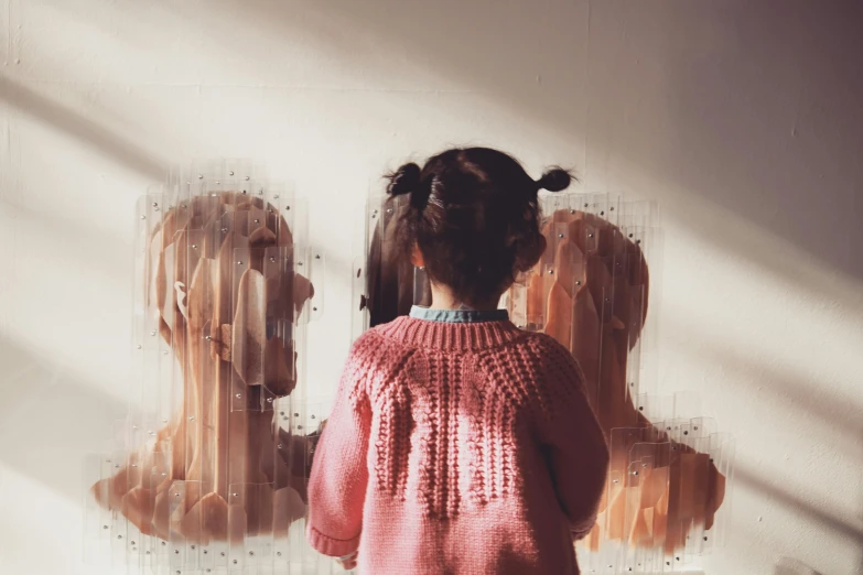 a little girl standing in front of a mirror, pexels contest winner, interactive art, 'a human head made of glass, pink clothes, museum painting, back lit