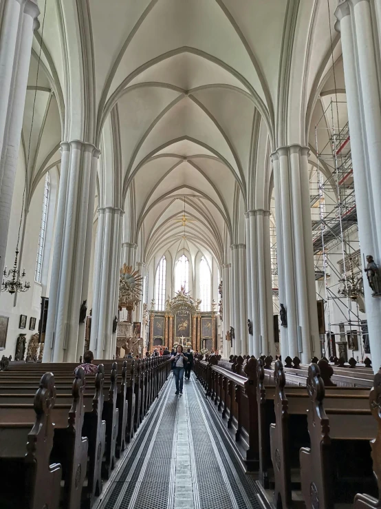 the inside of a church with rows of pews, inspired by Barthélemy d'Eyck, profile image, city of munich!!!, high ceiling, walking to the right