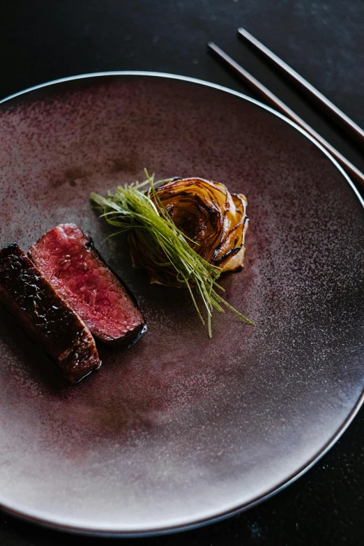 a close up of a plate of food with chopsticks, a portrait, inspired by Kanō Shōsenin, unsplash contest winner, smouldering charred timber, lamb and goat fused as one, award-winning crisp details”, “ iron bark