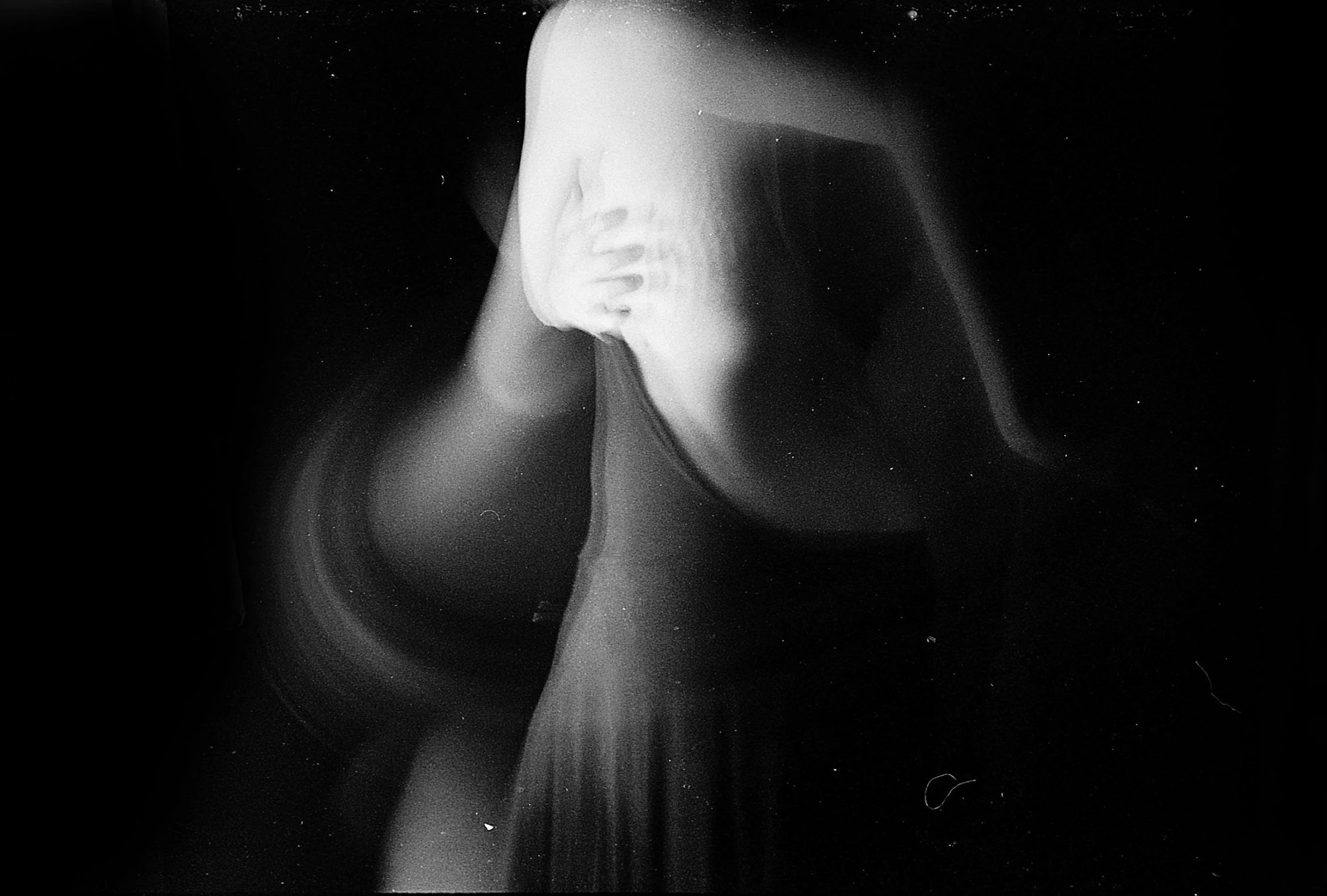 a black and white photo of a woman in a dress, inspired by Katia Chausheva, tumblr, conceptual art, night. by greg rutkowski, curved body, loving embrace, abstract figurative art