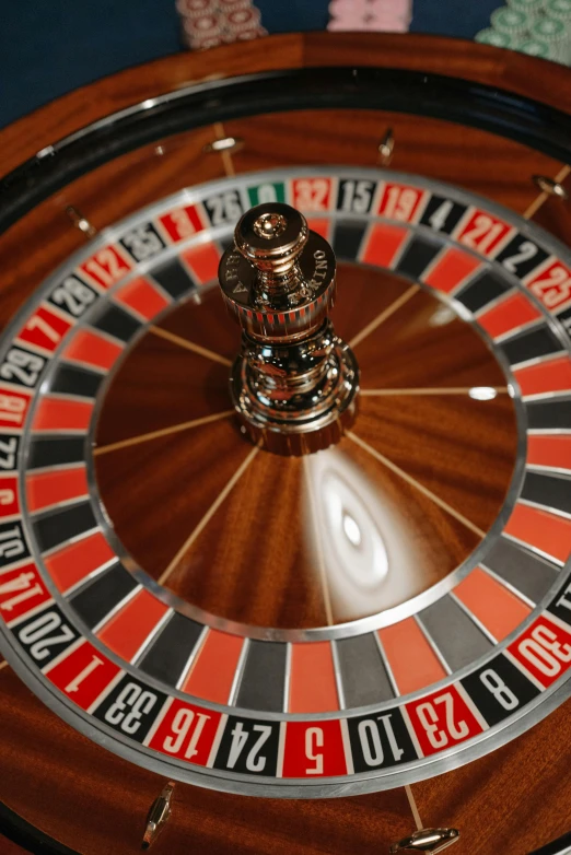 a close up of a roulet wheel on a table, online casino logo, birdseye view, thumbnail, ornately detailed