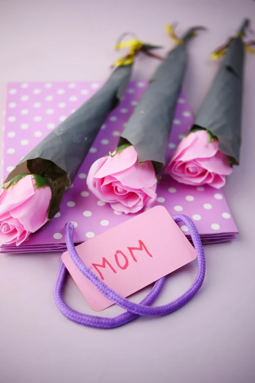 a bunch of pink roses sitting on top of a table, mom, 3 - piece, fan favorite, with a long