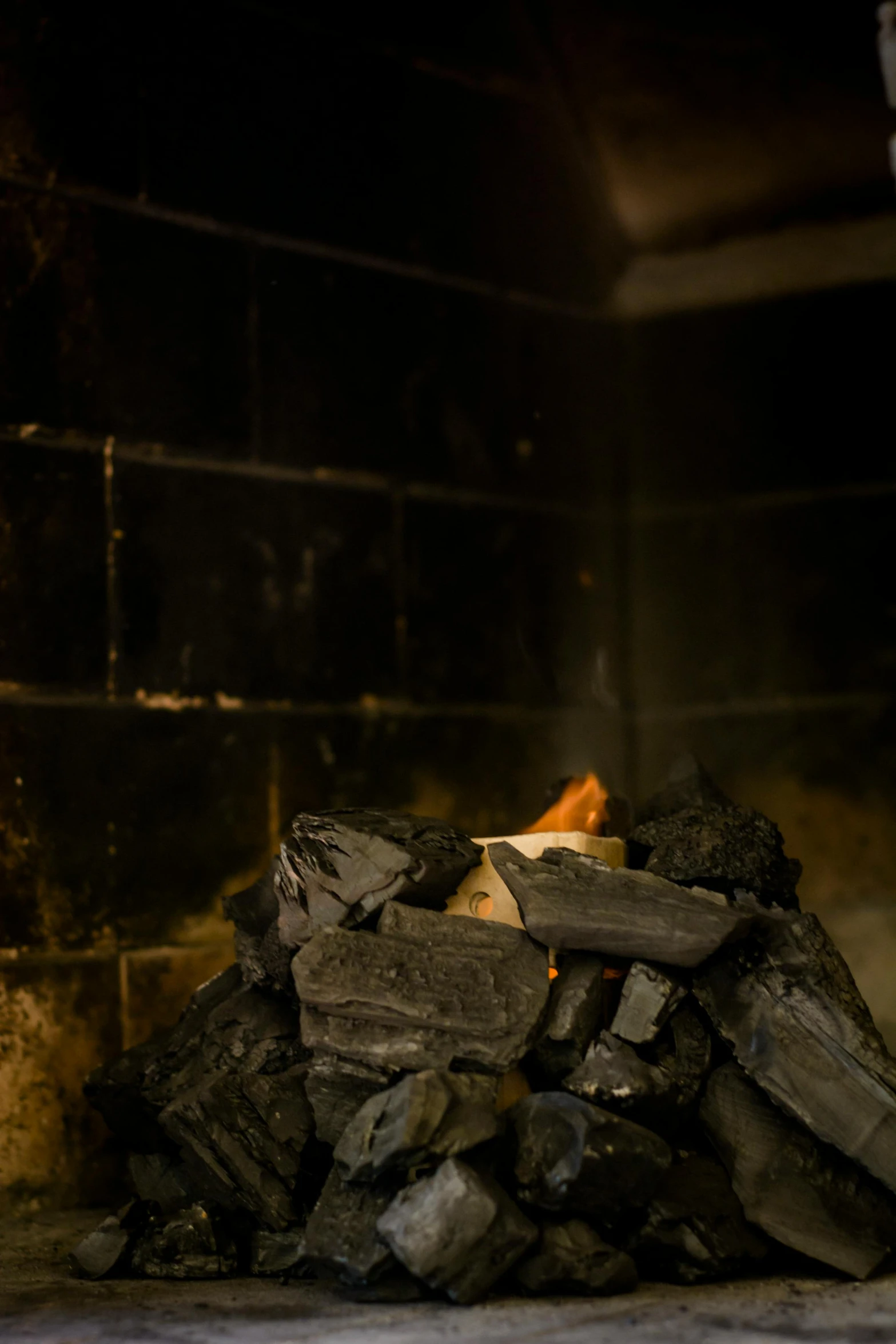 a close up of a fire in a brick oven, by Andries Stock, unsplash, conceptual art, sauna, david kassan, slate, black smoke