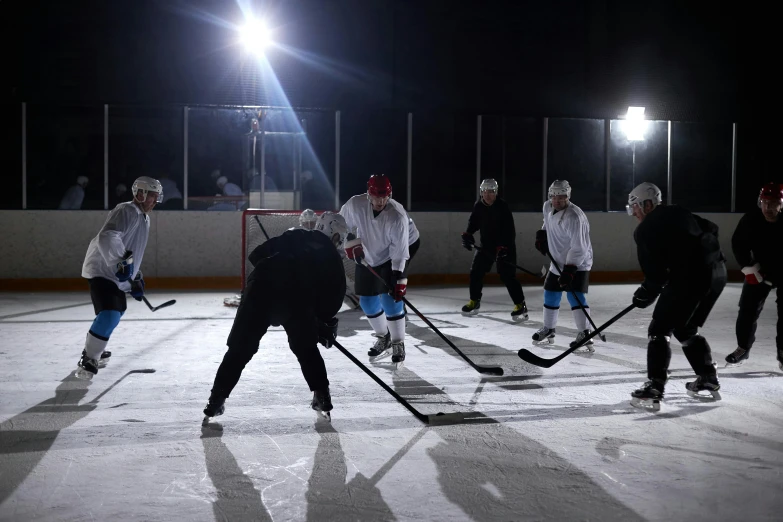 a group of people playing a game of hockey, reflective lighting, teaser, shot on sony a 7, fan favorite