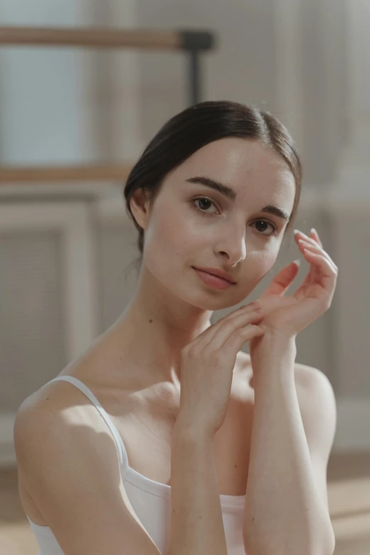 a woman in a white dress posing for a picture, by Emma Andijewska, trending on pexels, arabesque, square facial structure, soft light.4k, skin care, sleek hands