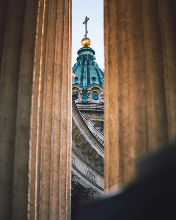 a large building with a cross on top of it, by Emma Andijewska, unsplash contest winner, neoclassicism, looking through a portal, dome, lgbtq, saint petersburg