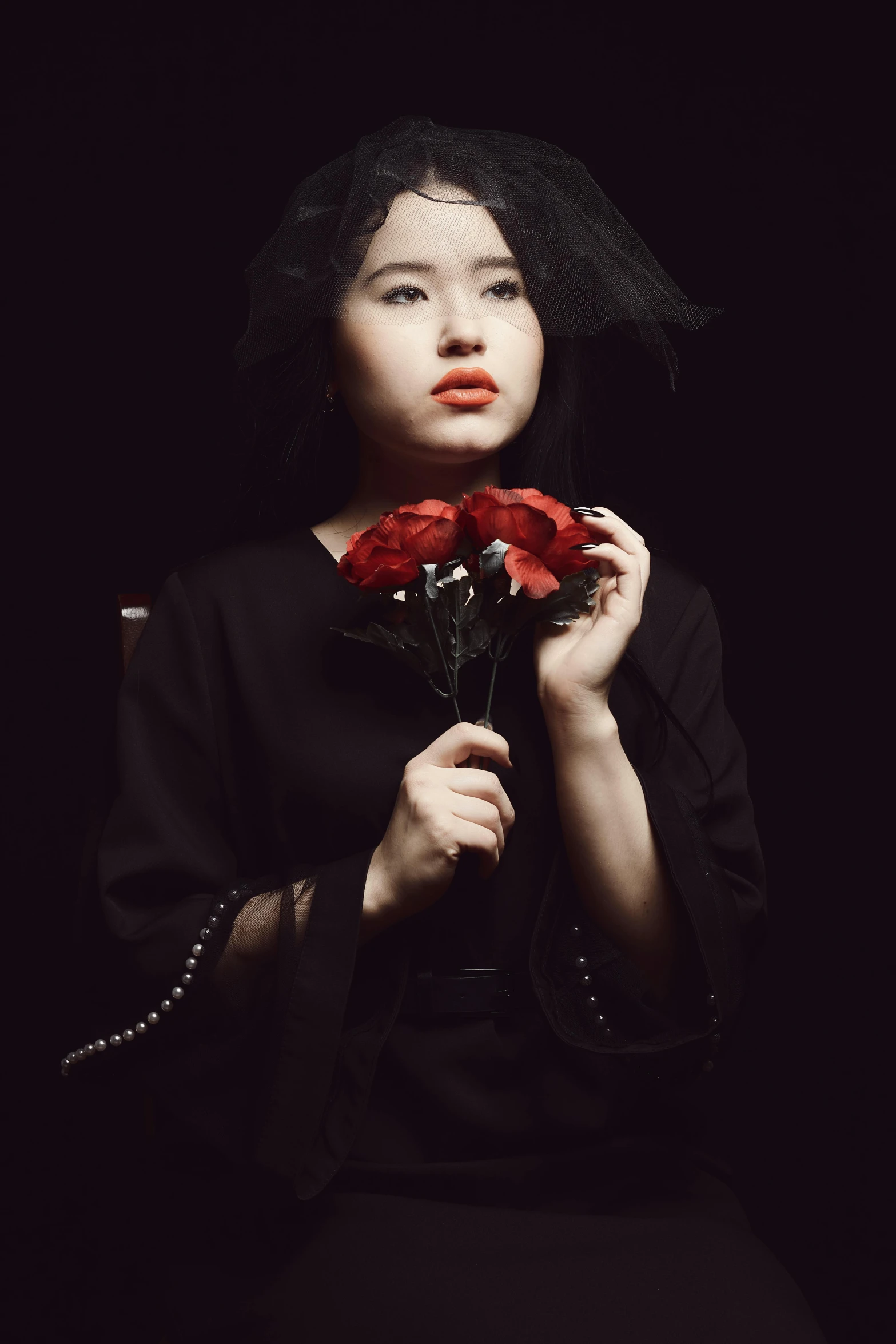 a woman in a black dress holding a red rose, an album cover, inspired by Ayako Rokkaku, pexels contest winner, ((portrait)), hoang long ly, melancholy, concert