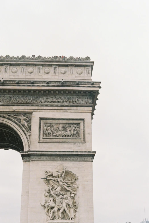 a couple of people that are standing in front of a arch, by Kristin Nelson, trending on unsplash, neoclassicism, eiffel tower left, square, medium closeup, monument