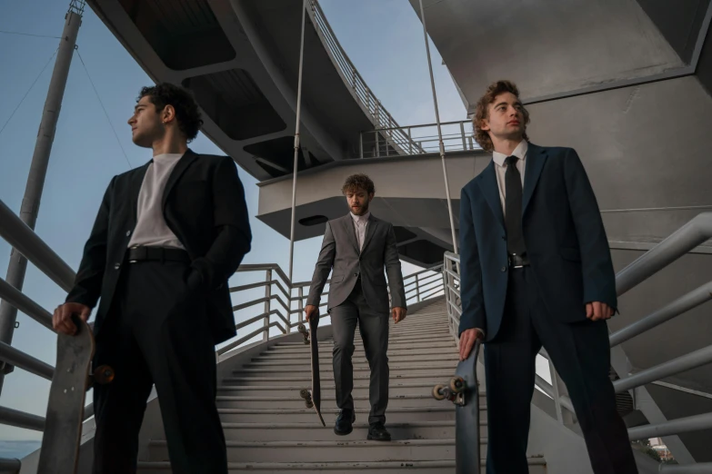 three men in suits walking up a flight of stairs, an album cover, by Emma Andijewska, pexels contest winner, renaissance, standing on a ship deck, intense look, solo performance unreal engine, three piece suit