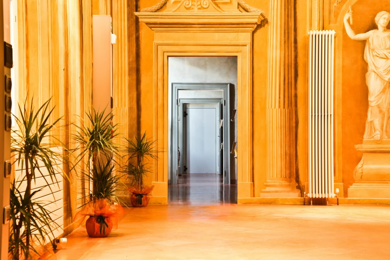 a hallway with a statue and potted plants, inspired by Piero della Francesca, flickr, warm orange lighting, marble columns, 3 doors, bright daylight indoor photo