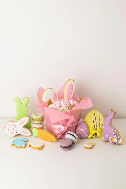 a bunch of cookies sitting on top of a table, a pastel, rabbit ears, detailed product image, full product shot, small