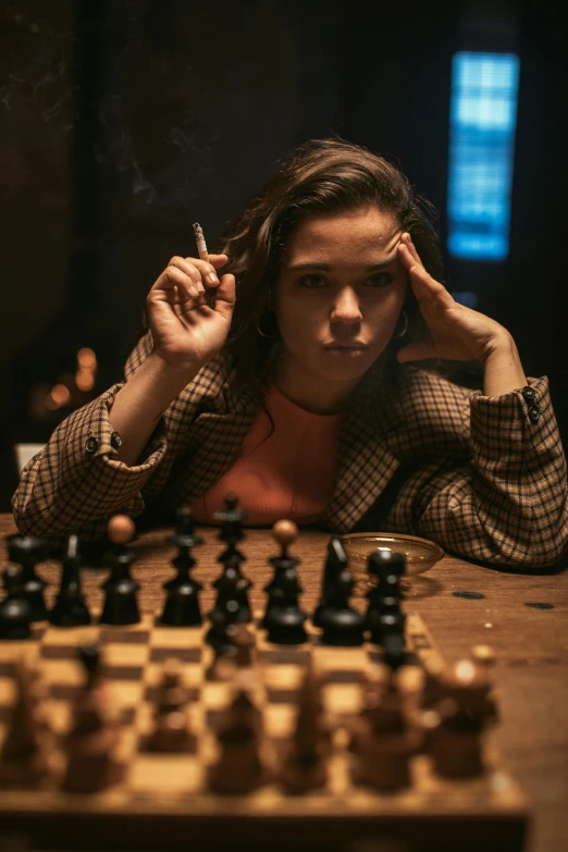 a woman sitting at a table with a chess board, a portrait, by Adam Marczyński, unsplash contest winner, wearing a turtleneck and jacket, hailee steinfeld, playing games, annoyed