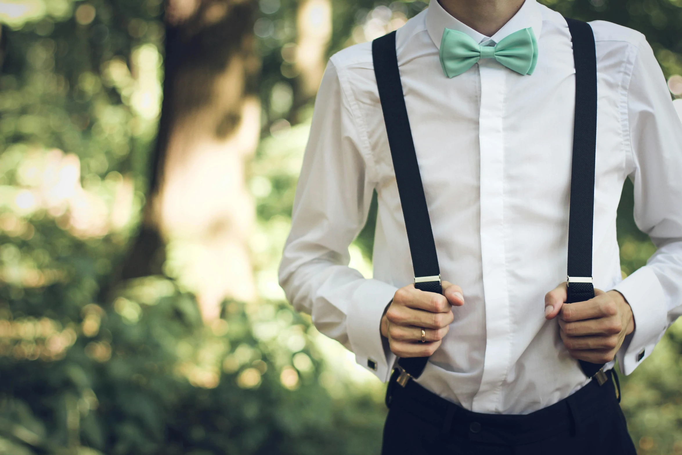 a man wearing a bow tie and suspenders, pexels, pastel green, teenage boy, wedding, wearing pants and a t-shirt