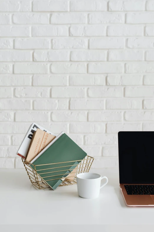 a laptop computer sitting on top of a white desk, by Carey Morris, holding books, wireframe, promo image, multiple stories