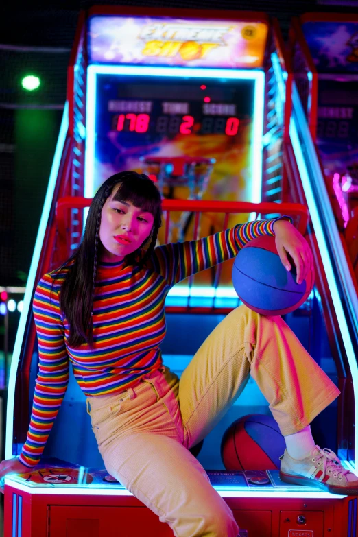 a woman sitting on top of a table next to a basketball ball, maximalism, arcade game, miranda cosgrove, colorful lenses, softplay