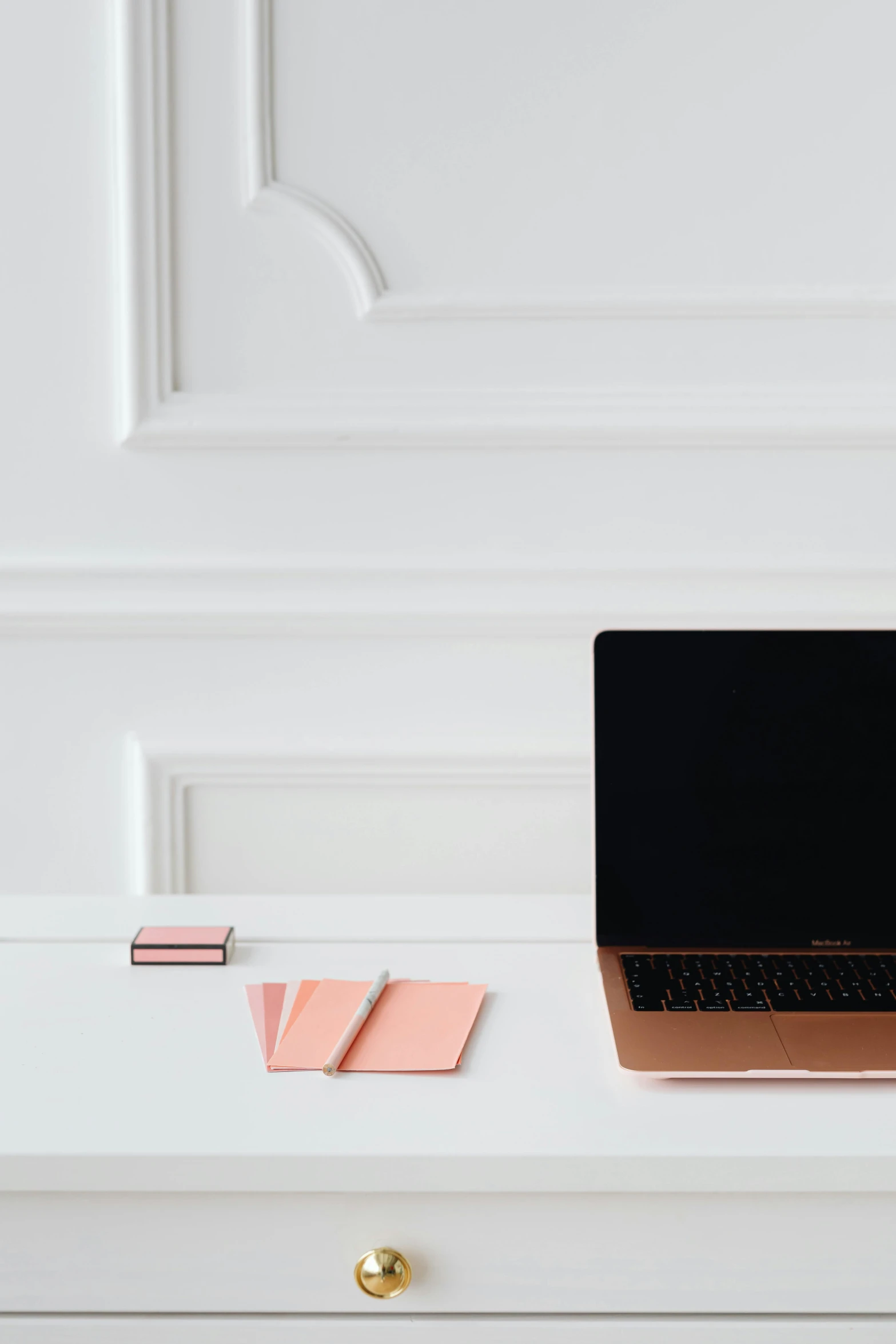 a laptop computer sitting on top of a white desk, by Carey Morris, trending on unsplash, rose gold, playing cards, minimalist structure, dwell