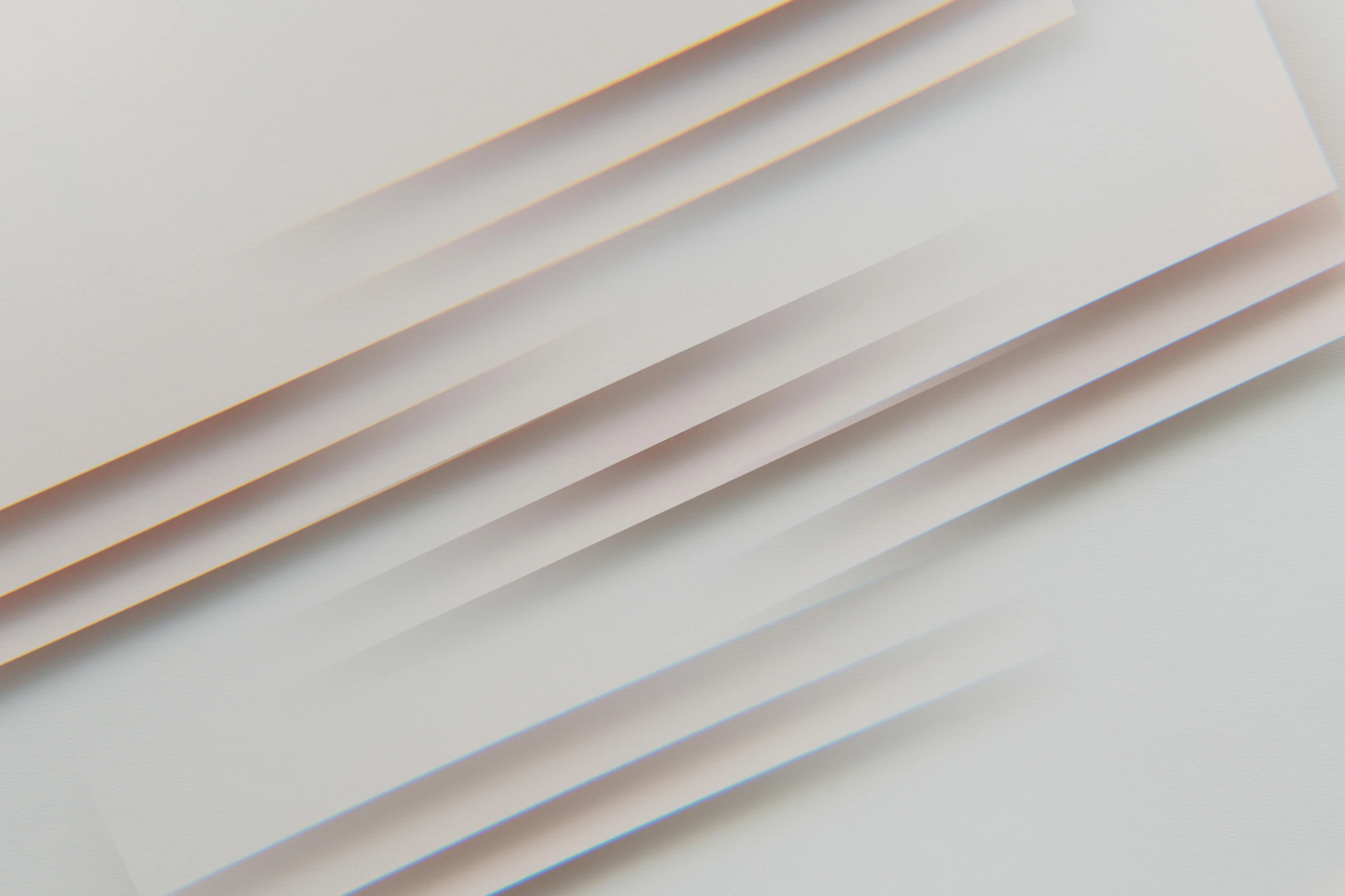 a bunch of papers stacked on top of each other, inspired by Zaha Hadid, unsplash, abstract art, pale gradients design, square lines, taupe, dynamic closeup