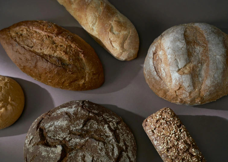 a bunch of bread sitting on top of a table, listing image, four hands, full product shot, brown