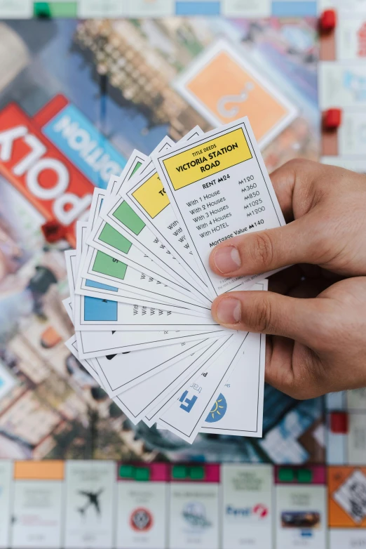 a close up of a person holding a bunch of cards, megalopolis, thumbnail, mrt, home