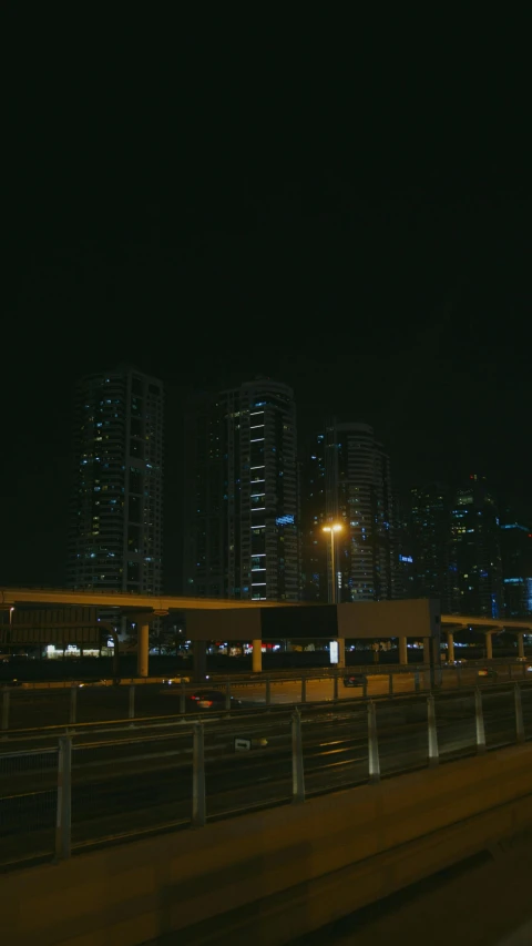 a view of a city at night from a moving car, pexels contest winner, hurufiyya, medium format. soft light, high quality photo, dubai, 4 k cinematic photo