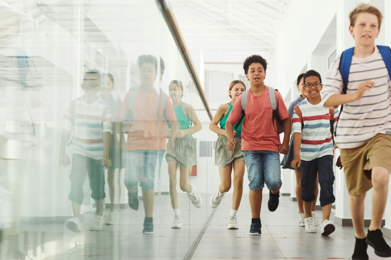 a group of children running down a hallway, by Jang Seung-eop, pexels contest winner, happening, mall background, nerds, varying ethnicities, summertime