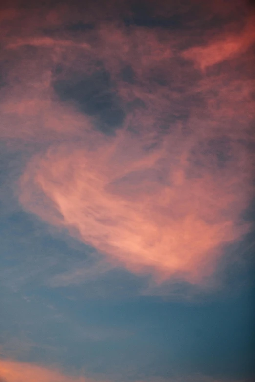 a plane that is flying in the sky, by Linda Sutton, flickr, romanticism, flaming heart, cotton candy, pareidolia, cupid