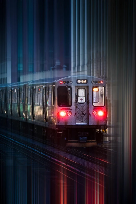 a train traveling down train tracks at night, by Leo Michelson, modern chicago streets, splash image, subway, instagram picture