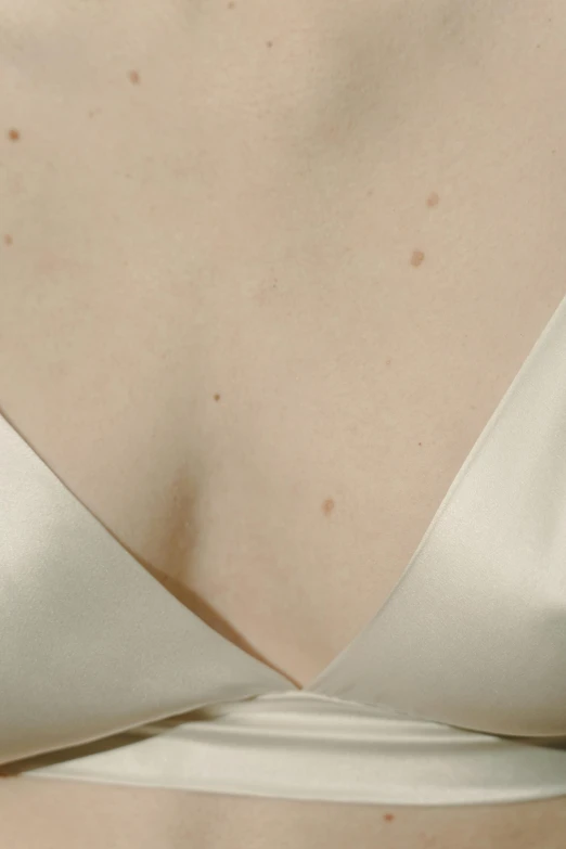 a close up of a woman wearing a white dress, an album cover, inspired by Vanessa Beecroft, reddit, renaissance, squashed berry stains, photography of todd hido, decolletage, varying dots