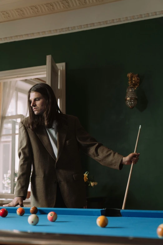 a man in a suit playing a game of pool, an album cover, inspired by Balthus, unsplash, magic realism, mid long hair, sebastian stan, movie still of a tired, leaning on door