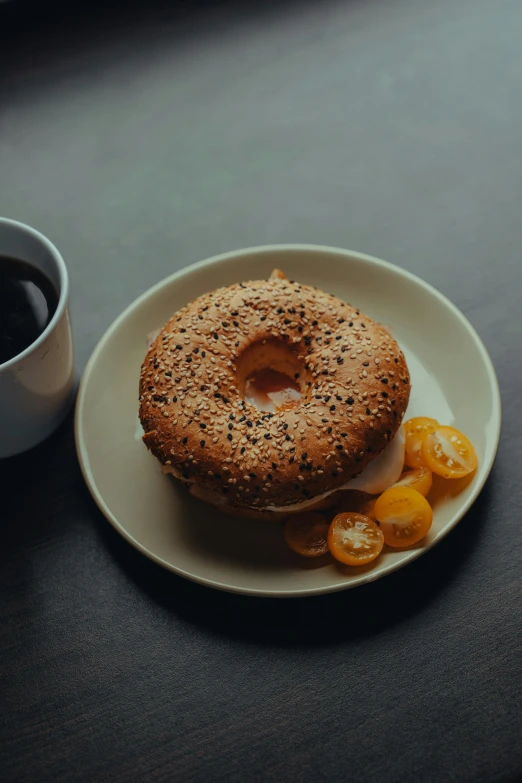 a bagel sitting on top of a white plate next to a cup of coffee, a portrait, trending on unsplash, dark skinned, ignant, pepper, 15081959 21121991 01012000 4k