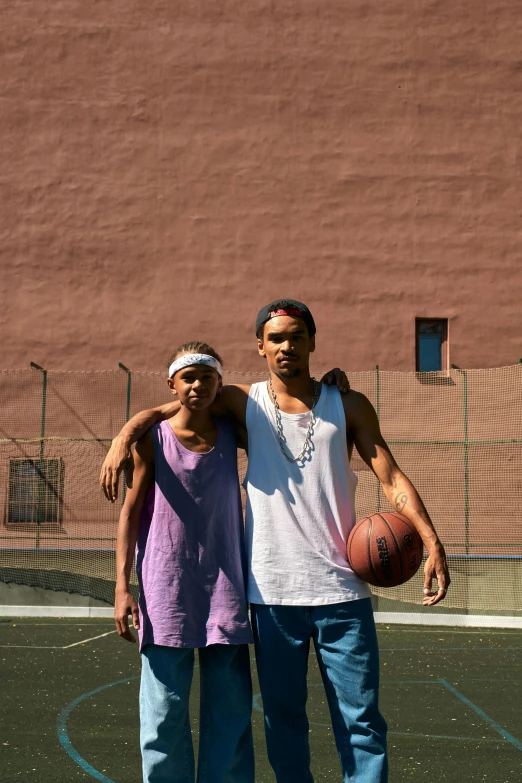 a couple of men standing next to each other on a basketball court, an album cover, by Washington Allston, unsplash, renaissance, los angeles 2 0 1 5, ( ( theatrical ) ), block party, adult pair of twins