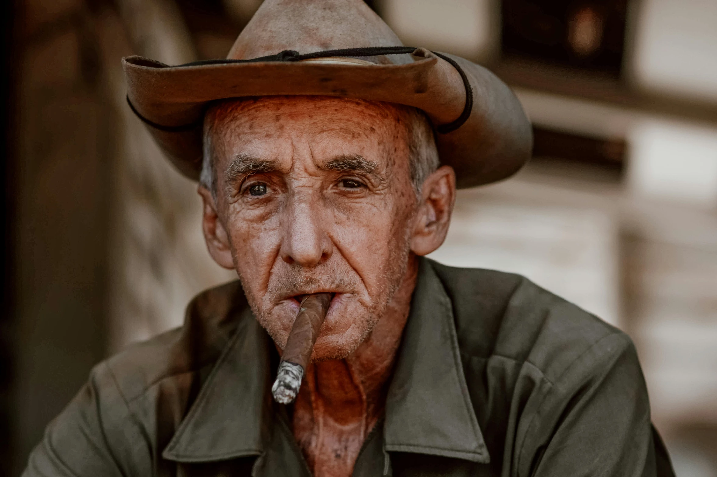 an old man wearing a hat and smoking a cigarette, by Peter Churcher, pexels contest winner, photorealism, brown, australia, old color photograph, multiple stories