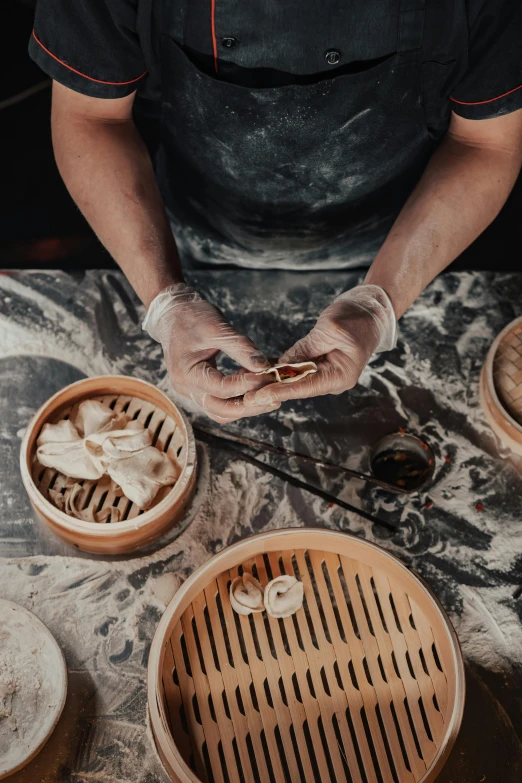 a man preparing dim dim dim dim dim dim dim dim dim dim dim dim dim dim dim dim dim dim dim dim dim dim dim dim dim, inspired by Qian Du, trending on pexels, process art, dumplings on a plate, crafting, marbling, center of image