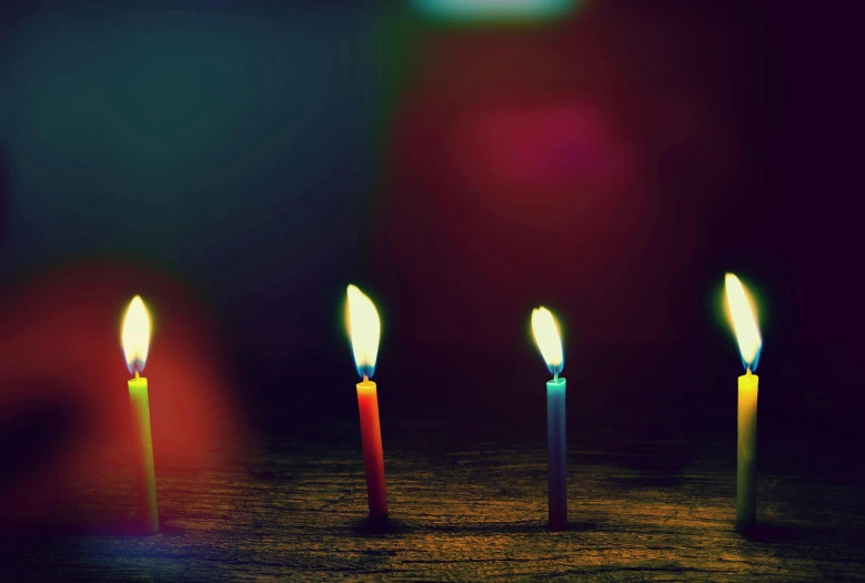 a group of lit candles sitting on top of a table, an album cover, inspired by Elsa Bleda, pexels, minimalism, cinema 4d colorful render, happy birthday, dark. no text, background image