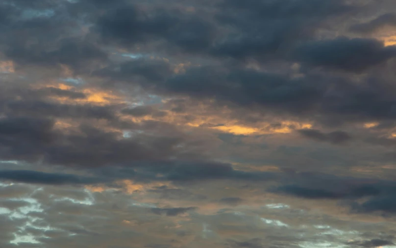 a large jetliner flying through a cloudy sky, a portrait, unsplash, tonalism, pastel sunset, steven outram hd, grey, detailed sky