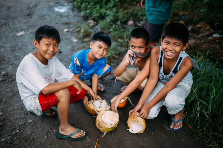 a group of young boys sitting next to each other, pexels contest winner, sumatraism, coconuts, avatar image, recipe, maintenance photo