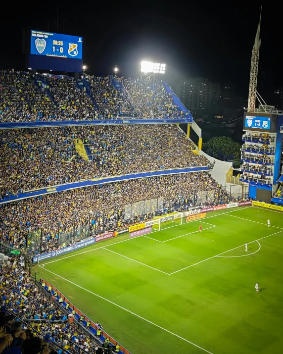 a stadium filled with lots of people watching a soccer game, by Matteo Pérez, happening, lgbt, blue and yellow theme, instagram post, taken in the late 2010s