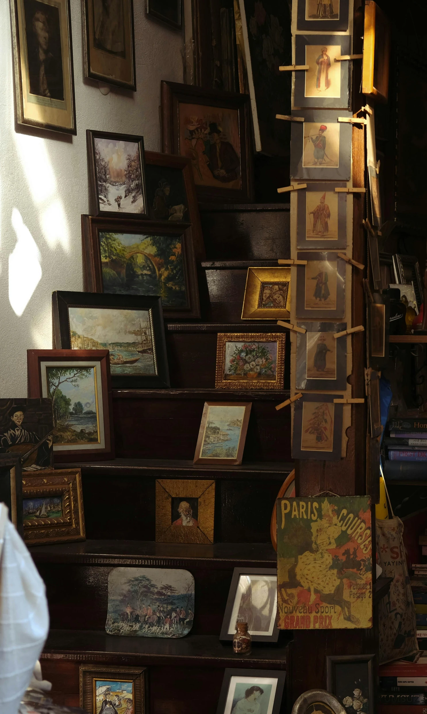 a woman standing in front of a bunch of pictures, flickr, arts and crafts movement, stairs and bookshelves, fantastic vendor interior, 3 d oil painting, waldo in the top right of frame