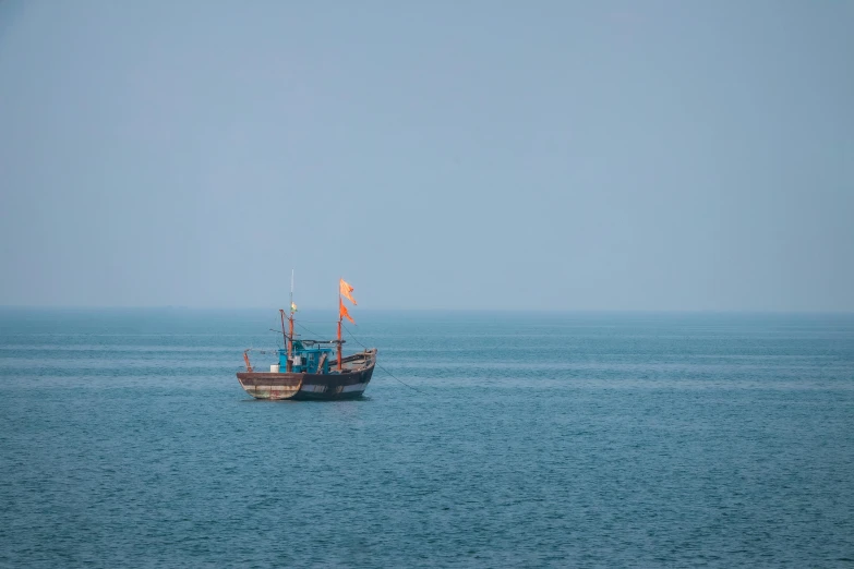 a boat in the middle of a large body of water, pexels contest winner, vietnam, medium format. soft light, square, pirate