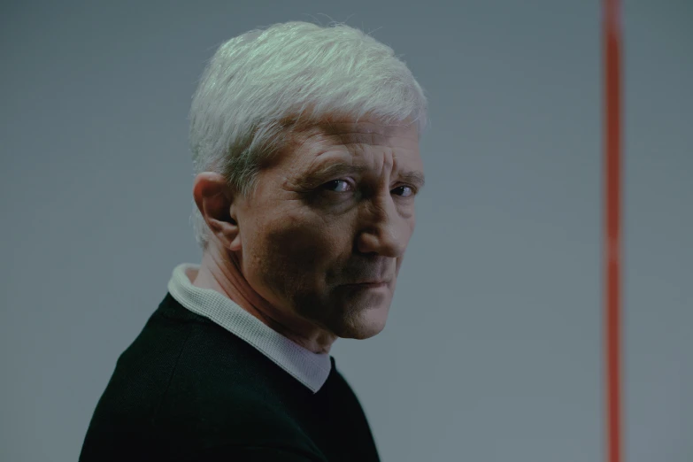a man with white hair wearing a black sweater, inspired by roger deakins, hyperrealism, morph dna, anomalisa, film still promotional image, colour photograph