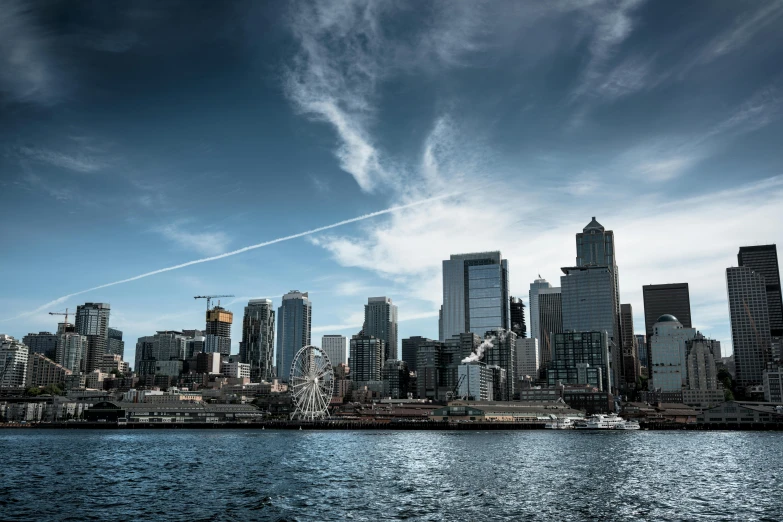 a large body of water with a city in the background, inspired by Thomas Struth, pexels contest winner, hurufiyya, seattle, low angle photo, view from the sea, photo 8 k