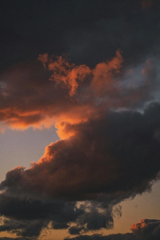 a couple of clouds that are in the sky, by Joe Stefanelli, ((sunset)), taken in the late 2010s, journalism photo