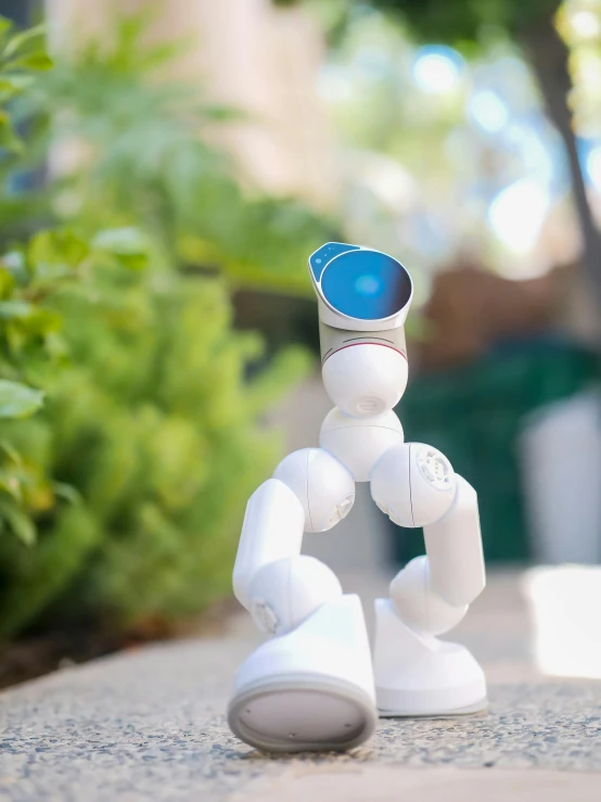 a robot that is sitting on a table, next to a plant, shot with sony alpha 1 camera, white cyclops portrait in sky, ((robot))